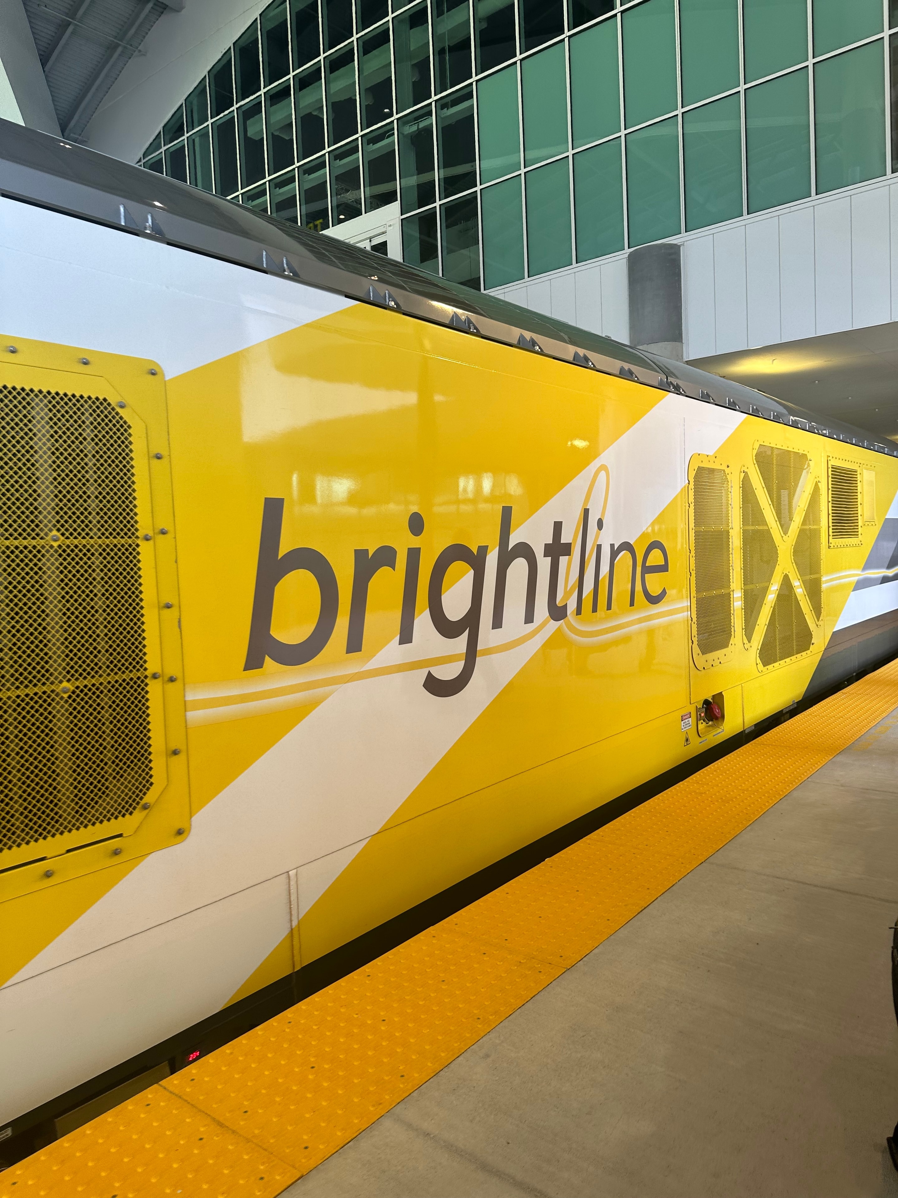 Brightline train at the Orlando station platform — the terminus that completed Florida's rail arc in 2024